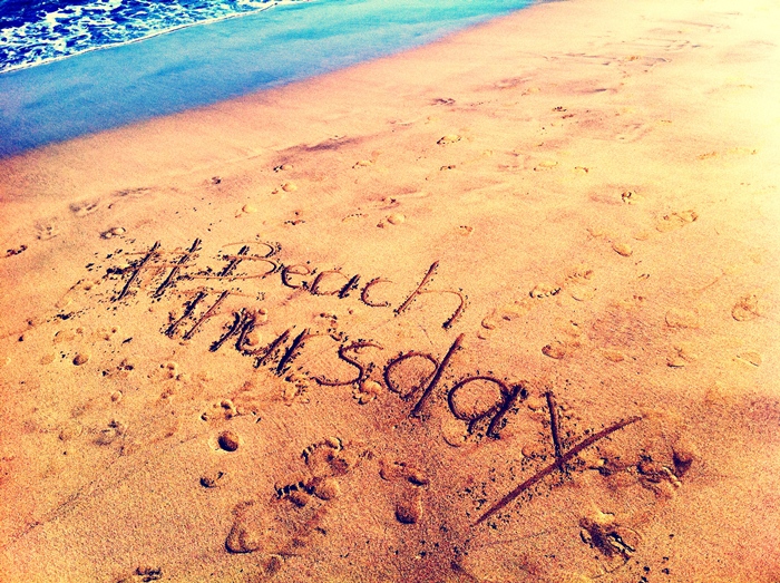 BeachThursday written in the sand
